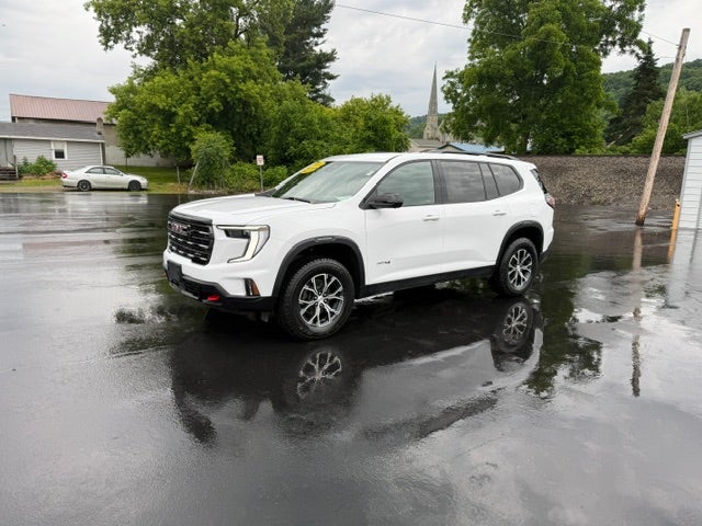 2024 GMC Acadia AT4 in Summit White — front three-quarter view